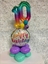 Picture of 1 JUNIOR AGED MARQUEE - 2 FOIL 16" NUMBERS - ON 18" FOIL SITTING ON  2 LEVEL QUAD BASE